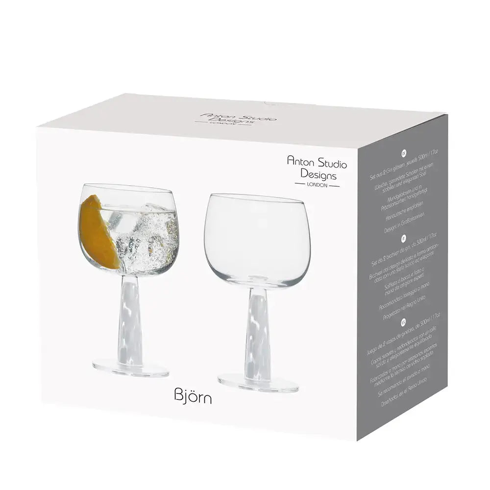 Boîte de présentation d’un duo de verres à gin, mettant en valeur un gin tonic raffiné garni d’une tranche d’agrume.